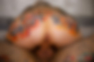 Tattooed Beauties in Passionate Bedroom Action