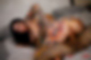 Tattooed Beauties in Passionate Bedroom Action